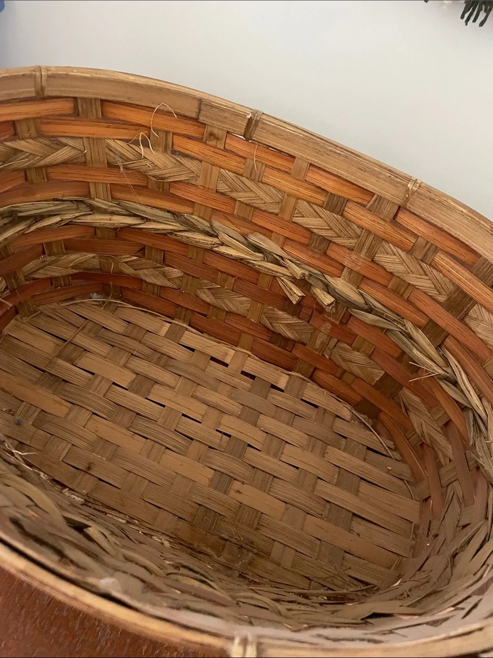 Brown and tan basket with handles